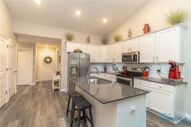 1948 Sunrise Creek Dr, Toledo, OH 43615 - kitchen featuring stainless steel appliances, a sink, backsplash, white cabinetry, and dark wood-type flooring