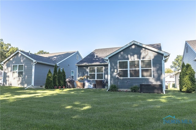 1948 Sunrise Creek Dr, Toledo, OH 43615 - rear view of property with a yard