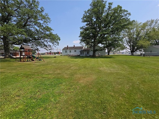 1649 N Perry St, Ottawa, OH 45875 - view of grassy yard featuring a playground