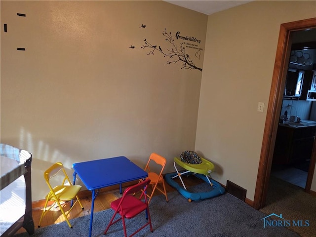 1649 N Perry St, Ottawa, OH 45875 - playroom featuring baseboards and carpet floors
