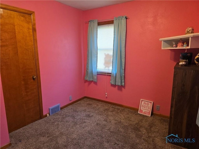 1649 N Perry St, Ottawa, OH 45875 - unfurnished bedroom with carpet flooring and baseboards