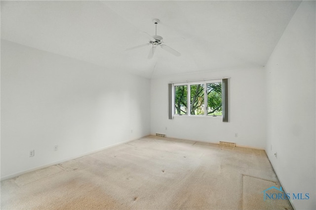 7430 Country Commons Ln Unit 7430, Sylvania, OH 43560 - carpeted spare room with a ceiling fan and vaulted ceiling