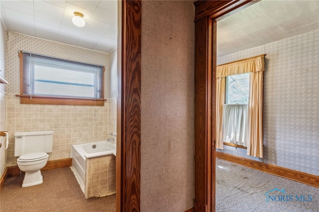 228 E Hale St, Ridgeway, OH 43345 - bathroom featuring a garden tub, toilet, and wallpapered walls