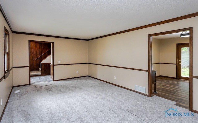 716 Maple St, Perrysburg, OH 43551 - carpeted empty room with baseboards and crown molding