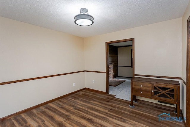 716 Maple St, Perrysburg, OH 43551 - unfurnished room with wood finished floors and a textured ceiling