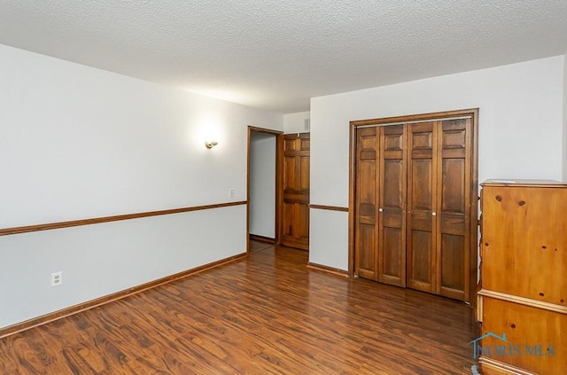 716 Maple St, Perrysburg, OH 43551 - unfurnished bedroom with wood finished floors and a closet