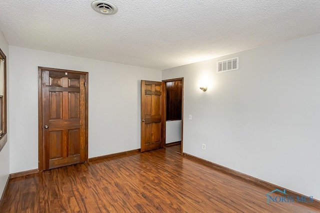 716 Maple St, Perrysburg, OH 43551 - unfurnished bedroom with wood finished floors and baseboards