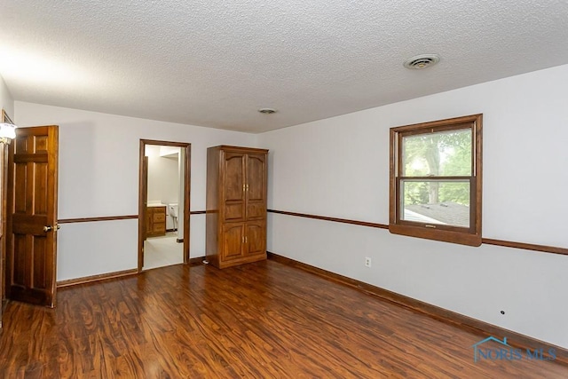 716 Maple St, Perrysburg, OH 43551 - unfurnished room featuring dark wood-style flooring and a textured ceiling