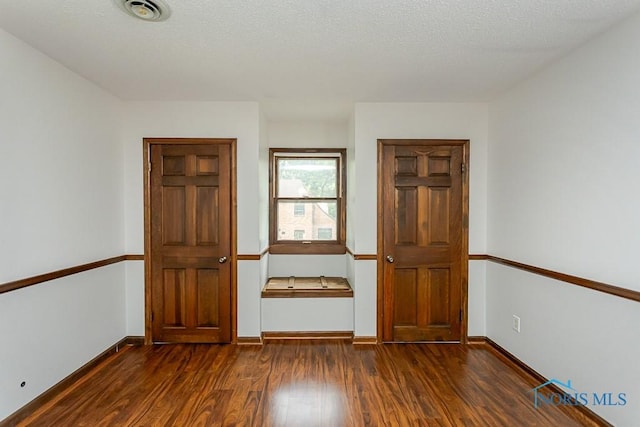 716 Maple St, Perrysburg, OH 43551 - unfurnished bedroom featuring dark wood-style floors and baseboards