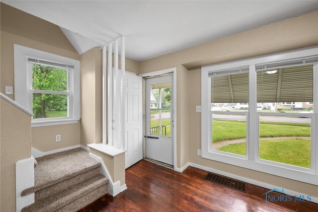 902 Coventry Ave, Toledo, OH 43607 - entrance foyer with baseboards, dark wood-type flooring, plenty of natural light, stairs, and vaulted ceiling