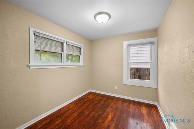 902 Coventry Ave, Toledo, OH 43607 - unfurnished room with baseboards and wood finished floors