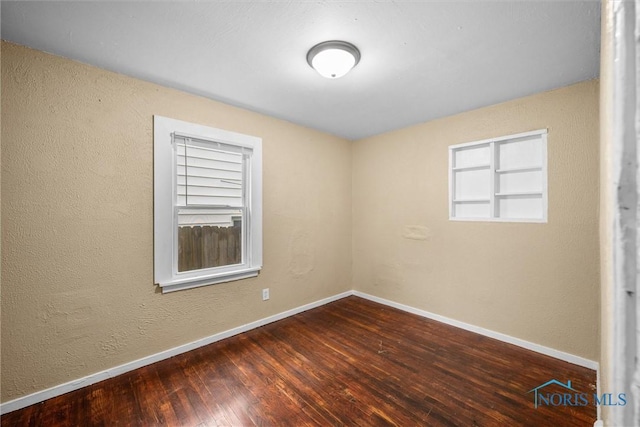 902 Coventry Ave, Toledo, OH 43607 - empty room with hardwood / wood-style floors, baseboards, and a textured wall