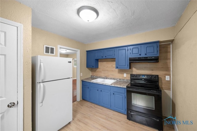 902 Coventry Ave, Toledo, OH 43607 - kitchen featuring freestanding refrigerator, black / electric stove, blue cabinets, under cabinet range hood, and a textured ceiling