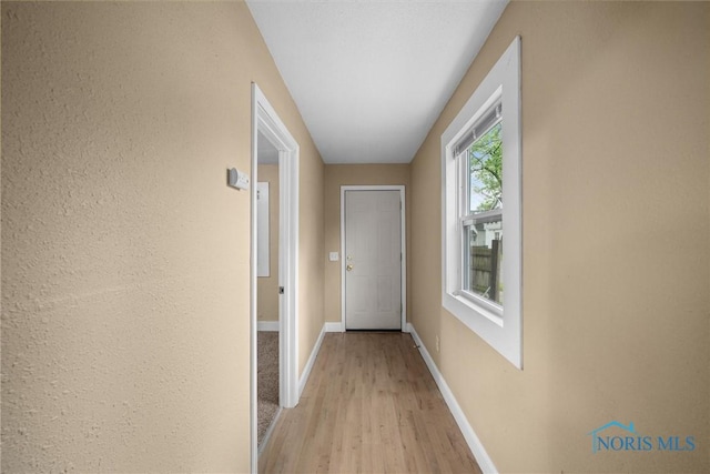 902 Coventry Ave, Toledo, OH 43607 - hall with light wood-style flooring and baseboards