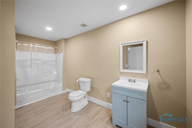902 Coventry Ave, Toledo, OH 43607 - full bath featuring toilet, wood finished floors, vanity, baseboards, and  shower combination