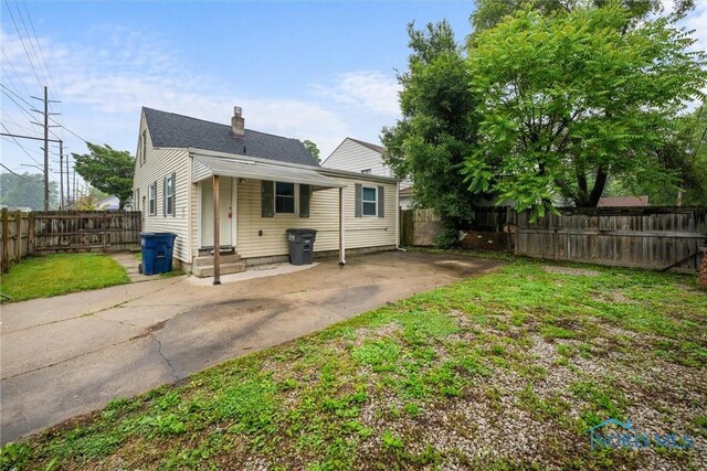 902 Coventry Ave, Toledo, OH 43607 - back of house with entry steps and a chimney