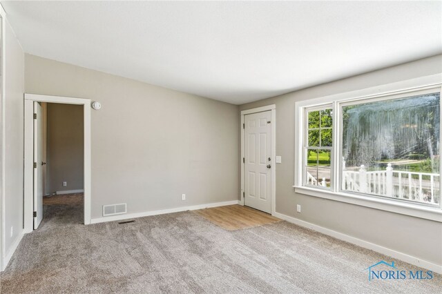 304 Wise St, Forest, OH 45843 - unfurnished room with carpet flooring and baseboards
