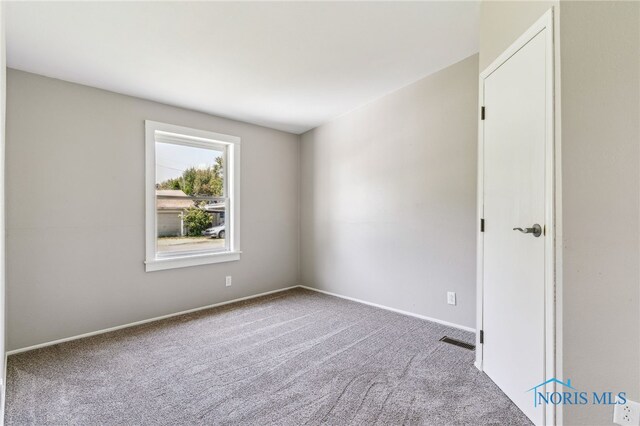 304 Wise St, Forest, OH 45843 - empty room with carpet flooring and baseboards