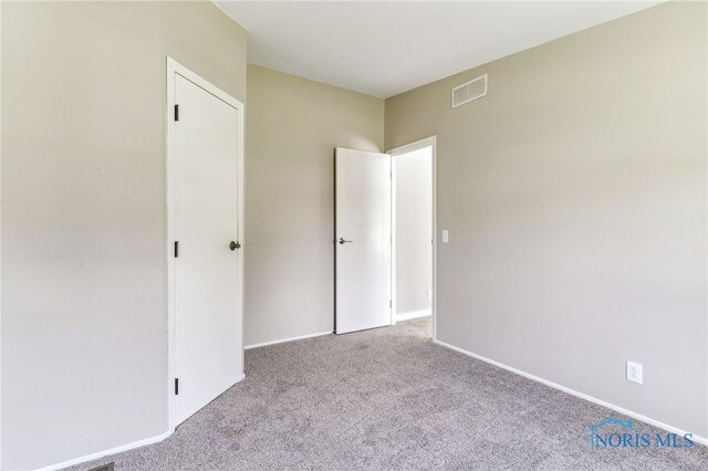304 Wise St, Forest, OH 45843 - unfurnished bedroom with carpet floors and baseboards