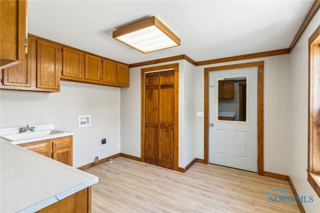 304 Wise St, Forest, OH 45843 - kitchen featuring light countertops, brown cabinets, and light wood-type flooring