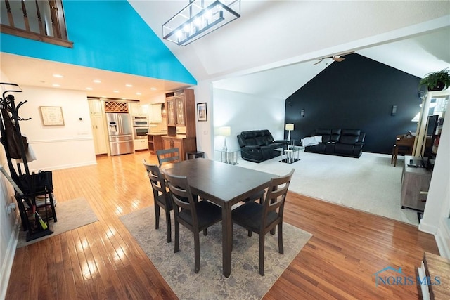 6975 Ramblehurst Rd, Sylvania, OH 43560 - dining room with light wood-style floors, vaulted ceiling, and a ceiling fan