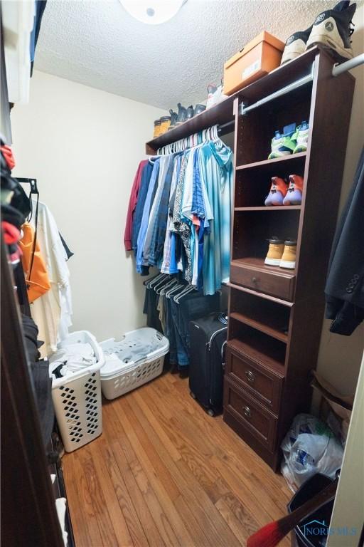 6975 Ramblehurst Rd, Sylvania, OH 43560 - spacious closet featuring wood finished floors