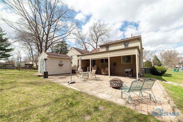 6975 Ramblehurst Rd, Sylvania, OH 43560 - rear view of house with an outdoor fire pit, a patio, and an outdoor structure