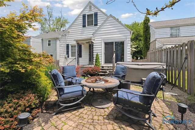 2707 Gunckel Blvd, Toledo, OH 43606 - view of patio / terrace with a hot tub and an outdoor fire pit