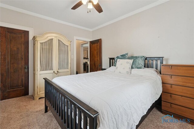 2707 Gunckel Blvd, Toledo, OH 43606 - bedroom with light carpet, ornamental molding, and ceiling fan