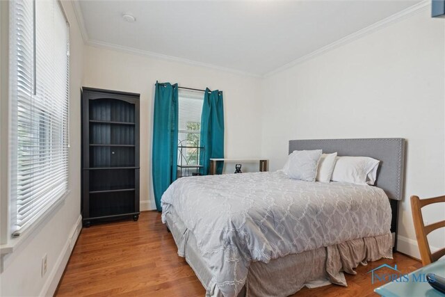 2707 Gunckel Blvd, Toledo, OH 43606 - bedroom featuring ornamental molding and wood finished floors