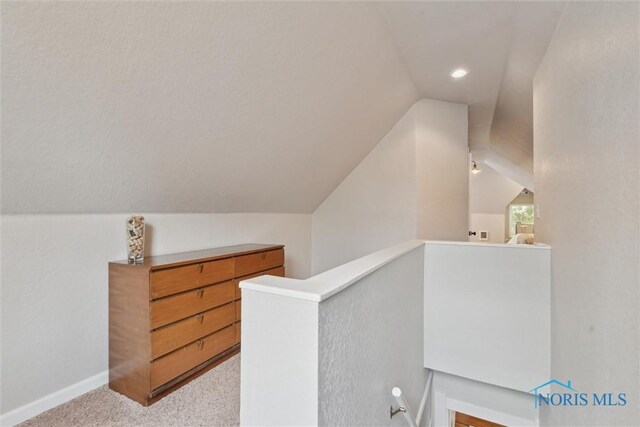 2707 Gunckel Blvd, Toledo, OH 43606 - corridor featuring vaulted ceiling, light carpet, an upstairs landing, and recessed lighting