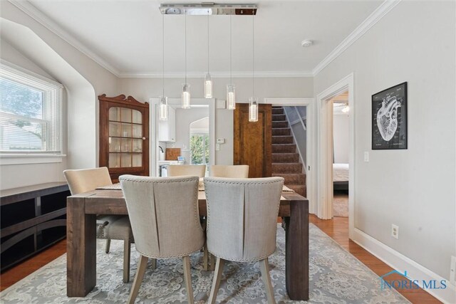 2707 Gunckel Blvd, Toledo, OH 43606 - dining room featuring stairs, ornamental molding, and wood finished floors