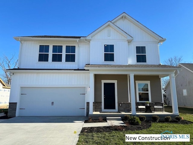 761 Wexford Dr, Bowling Green, OH 43402 - view of front of house featuring covered porch, an attached garage, and driveway