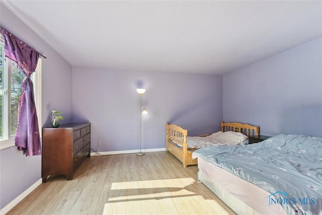 2540 Plum Leaf Ln, Toledo, OH 43614 - bedroom with wood finished floors and multiple windows