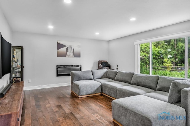2709 Derby Rd, Ottawa Hills, OH 43615 - living area with dark wood finished floors, recessed lighting, and heating unit