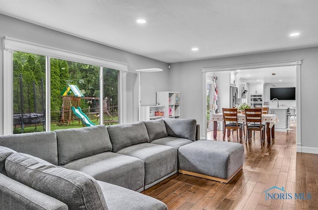 2709 Derby Rd, Ottawa Hills, OH 43615 - living area with dark wood-style flooring and recessed lighting