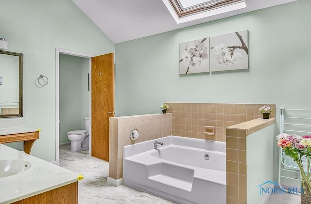 2709 Derby Rd, Ottawa Hills, OH 43615 - bathroom with a skylight, vanity, a garden tub, and lofted ceiling