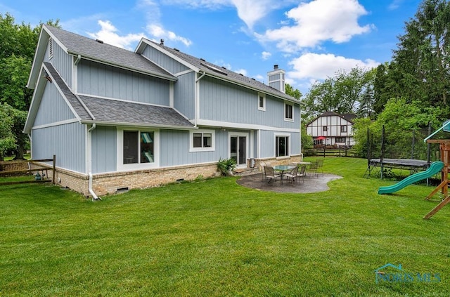 2709 Derby Rd, Ottawa Hills, OH 43615 - rear view of property with roof with shingles, a playground, a chimney, and a patio