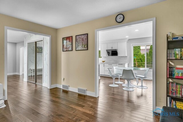 2709 Derby Rd, Ottawa Hills, OH 43615 - living area with hardwood / wood-style flooring and baseboards