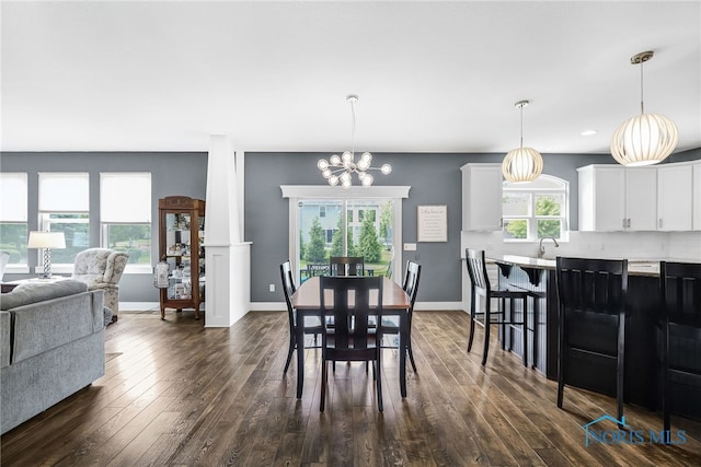 9211 Stable Creek Ct, Sylvania, OH 43560 - dining area featuring dark wood finished floors, a chandelier, and recessed lighting