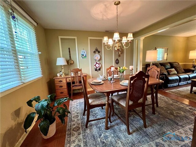 6312 Meadowlark Ln, Payne, OH 45880 - dining area with wood finished floors and a chandelier