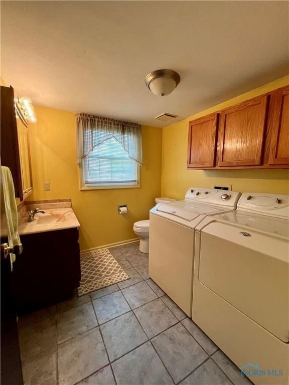 6312 Meadowlark Ln, Payne, OH 45880 - laundry area with separate washer and dryer and light tile patterned flooring