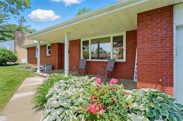 642 Edith Ave, Findlay, OH 45840 - doorway to property featuring brick siding and covered porch