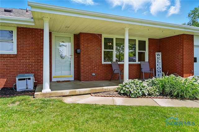 642 Edith Ave, Findlay, OH 45840 - entrance to property featuring covered porch and brick siding