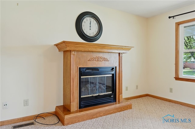 642 Edith Ave, Findlay, OH 45840 - detailed view of a glass covered fireplace and carpet