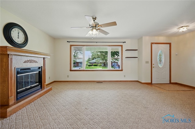 642 Edith Ave, Findlay, OH 45840 - unfurnished living room with ceiling fan, carpet floors, and a glass covered fireplace