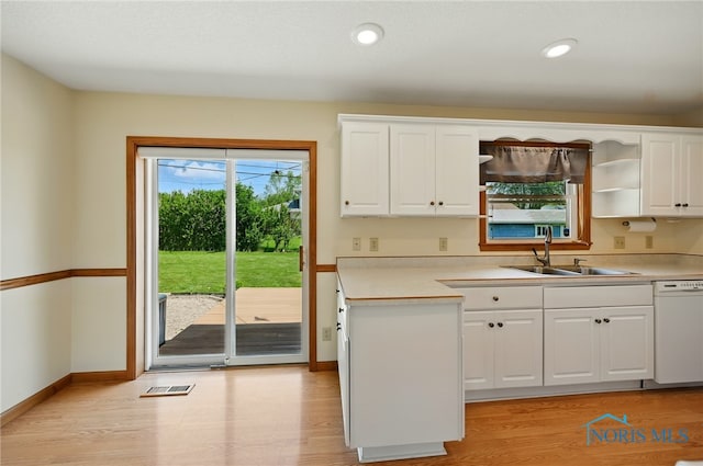 642 Edith Ave, Findlay, OH 45840 - kitchen with dishwasher, white cabinets, light wood finished floors, light countertops, and recessed lighting
