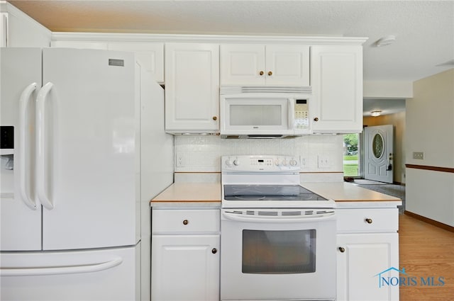 642 Edith Ave, Findlay, OH 45840 - kitchen featuring white appliances, light wood-type flooring, white cabinets, and light countertops
