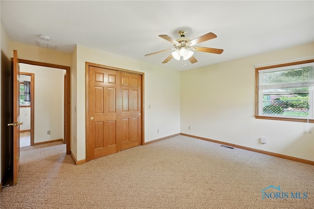 642 Edith Ave, Findlay, OH 45840 - unfurnished bedroom featuring carpet flooring, a closet, and a ceiling fan