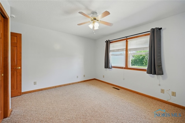 642 Edith Ave, Findlay, OH 45840 - carpeted spare room featuring a ceiling fan and baseboards